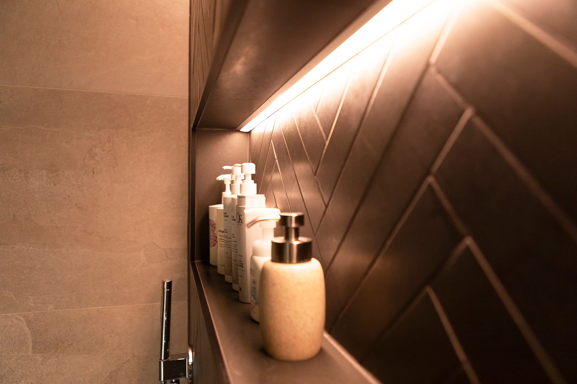 Shampoo shelf with led strip creating indirect highlighting light. Led ribbon in the flush-mounted profile. Ledstore.fi